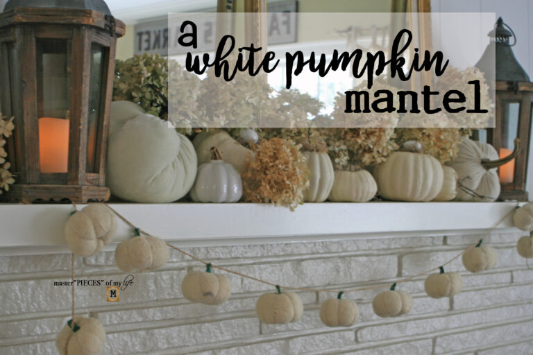a white pumpkin mantel