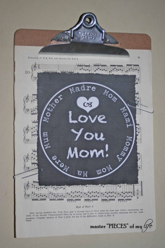 Mother's Day chalkboard graphic on cllpboard with vintage sheet music