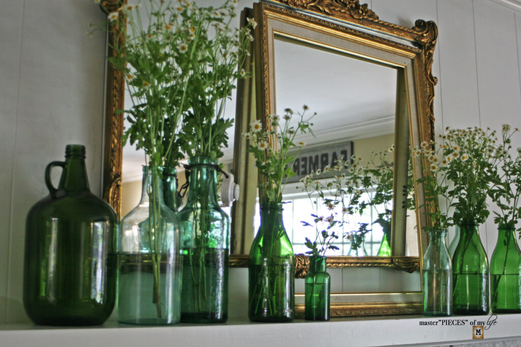 vintage green bottle collection mantel styling