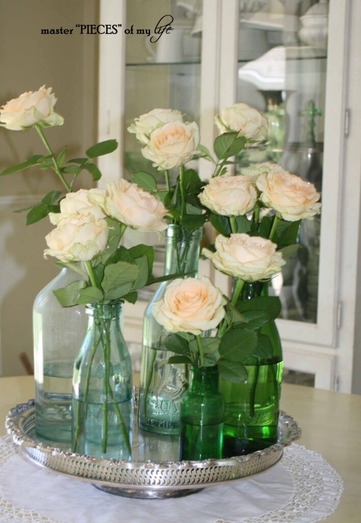 Green bottles with blush roses