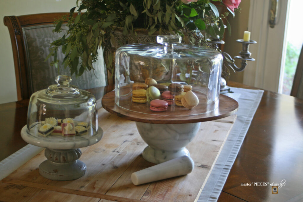 marble and wood pedestal stands