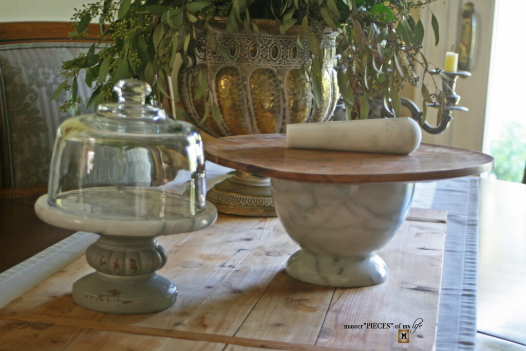 marble and wood pedestal stands