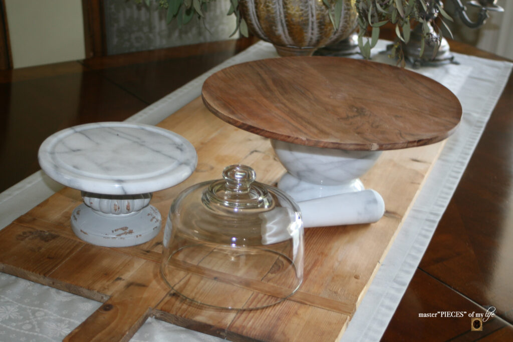 marble and wood pedestal stands