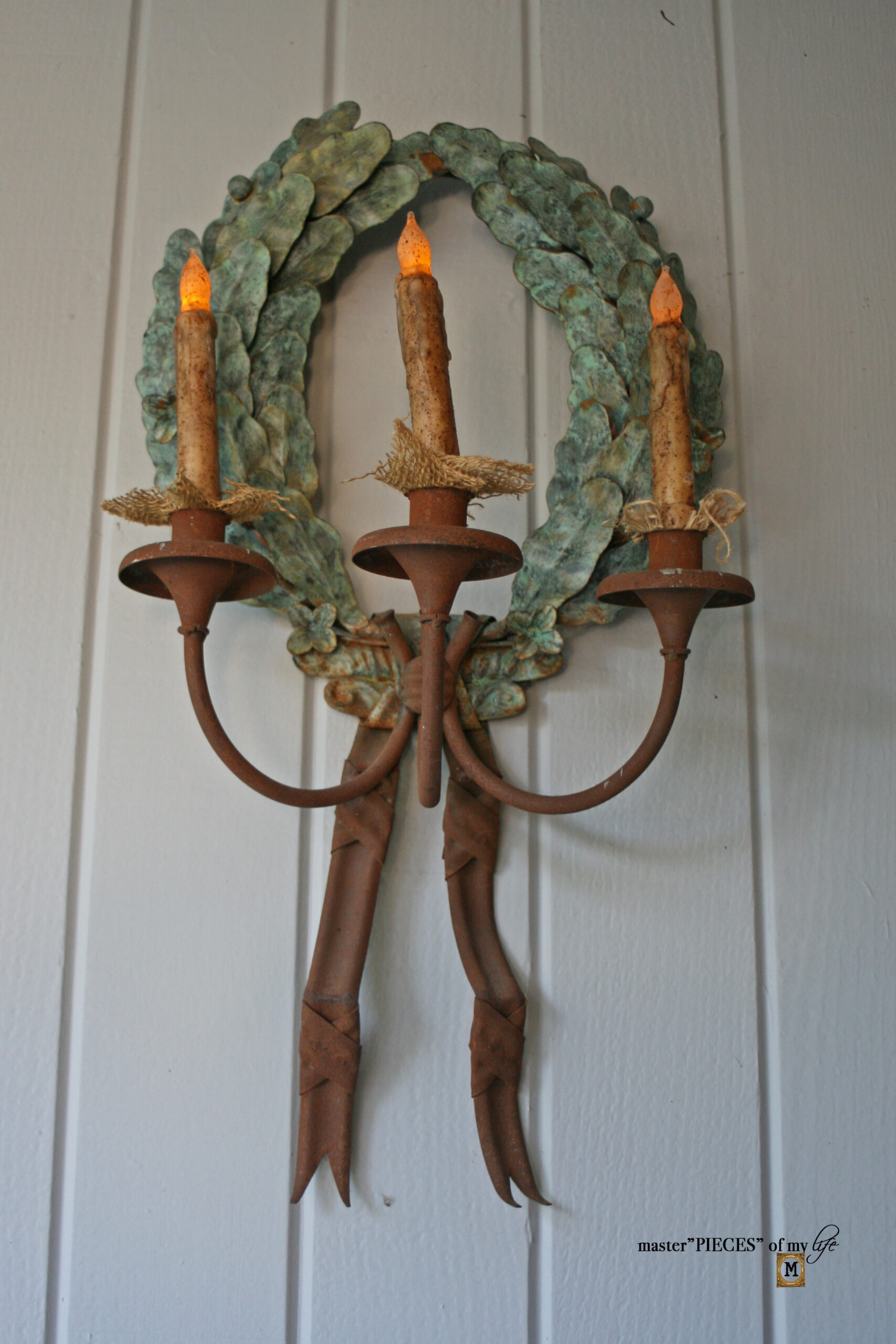 cast iron laurel candelabra on front porch