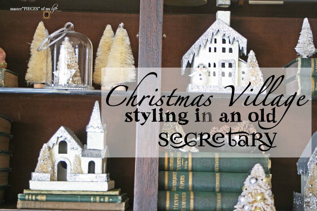 christmas village styling in an antique secretary desk