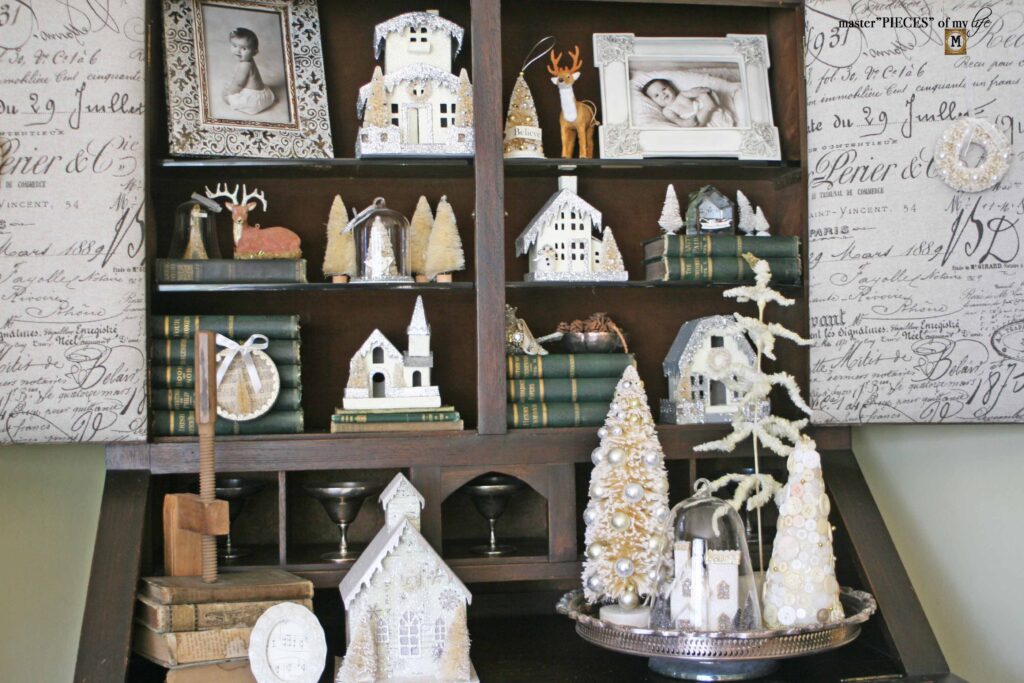 Christmas village styling in an old secretary