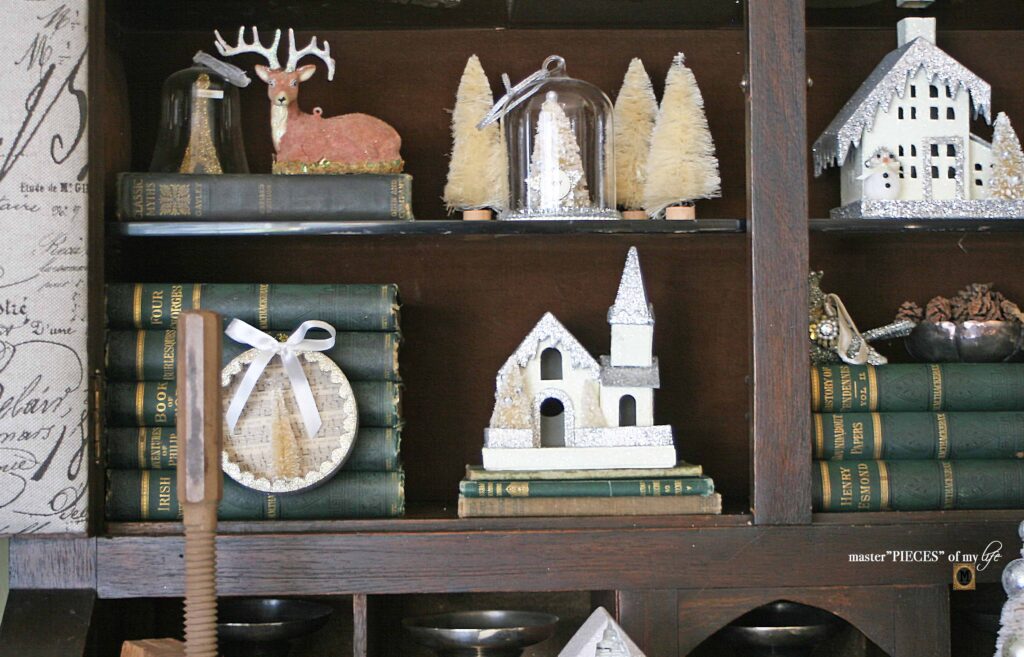 Christmas village styling in an old secretary