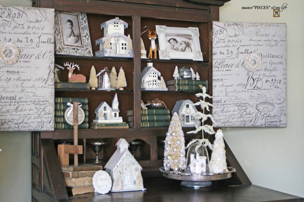 Christmas village styling in an old secretary