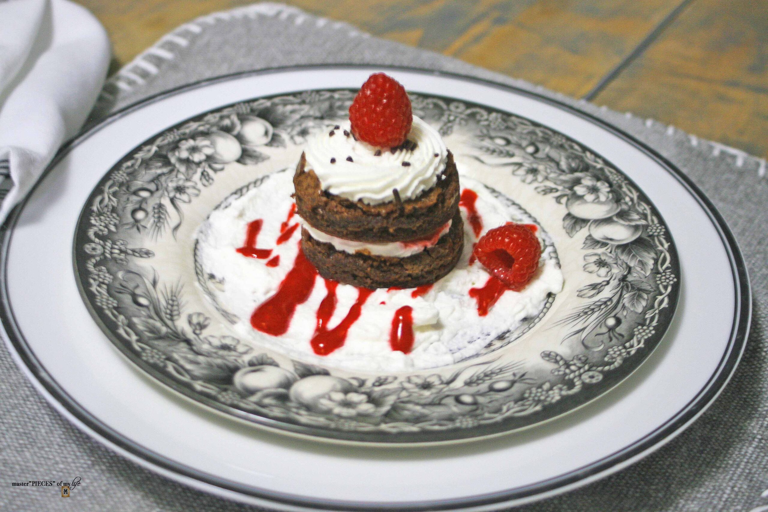 Brownie stack with raspberry coulis