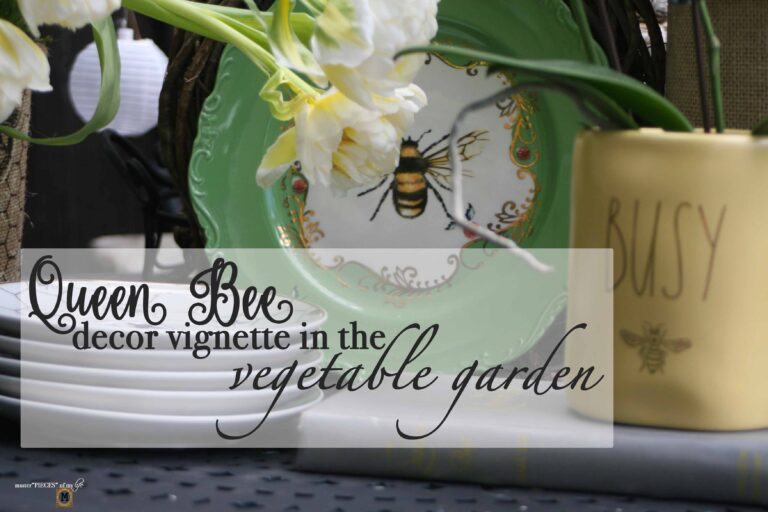 queen bee decor vignette in the vegetable garden