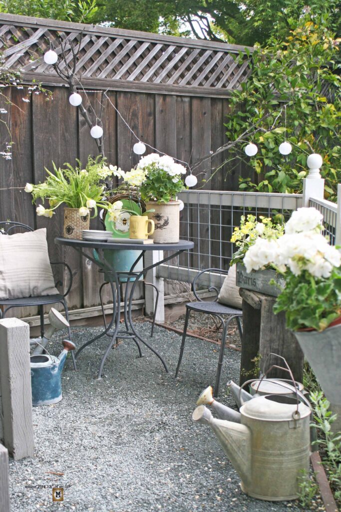 queen bee decor vignette in the vegetable garden