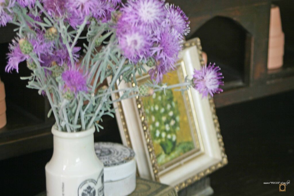 garden decor in an antique secretary desk