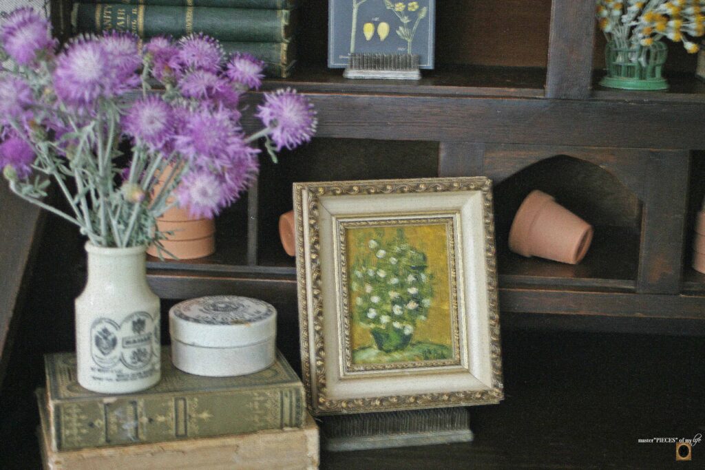 garden decor in an antique secretary desk
