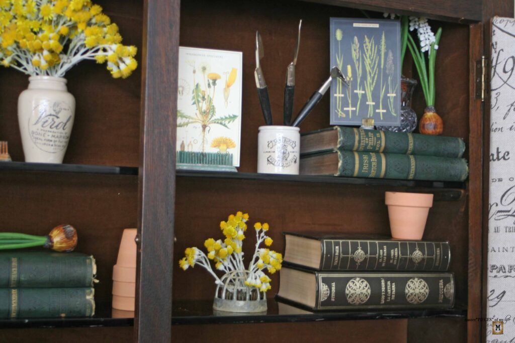 garden decor in an antique secretary desk