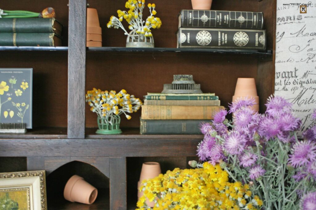 garden decor in an antique secretary desk