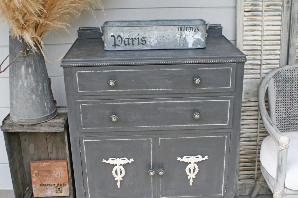 an old, shabby dresser refurbished into an outdoor sideboard