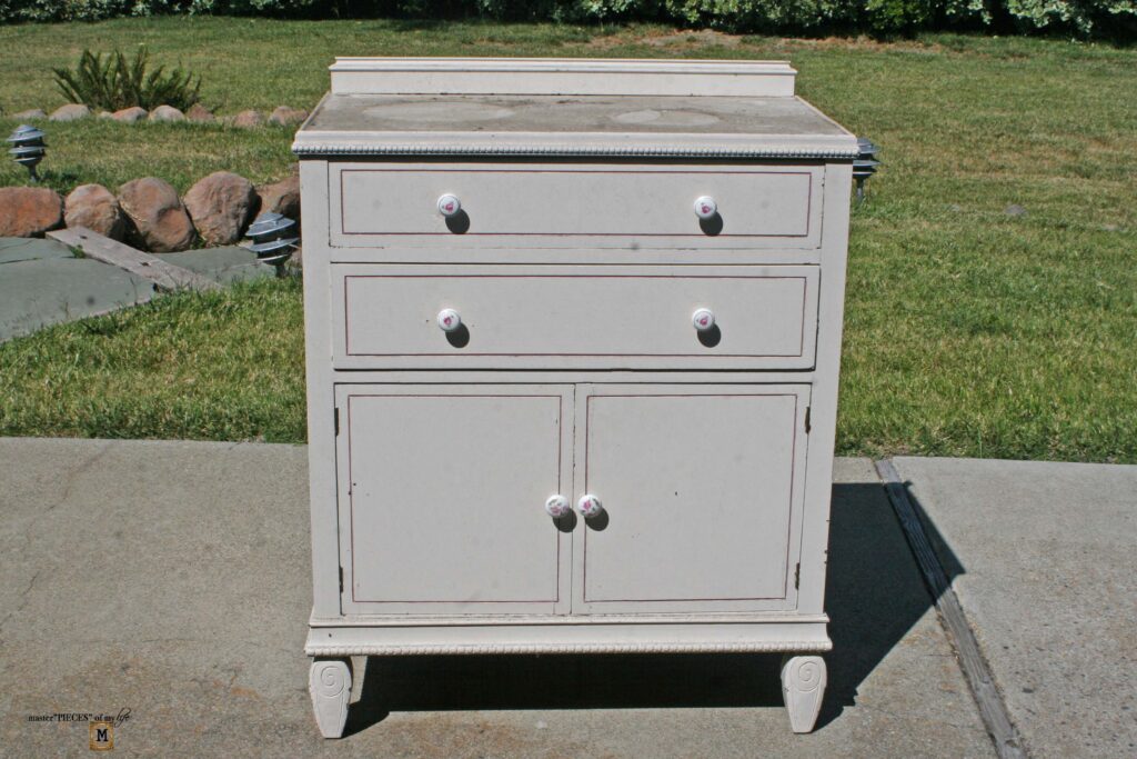 an old, shabby dresser refurbished into an outdoor sideboard