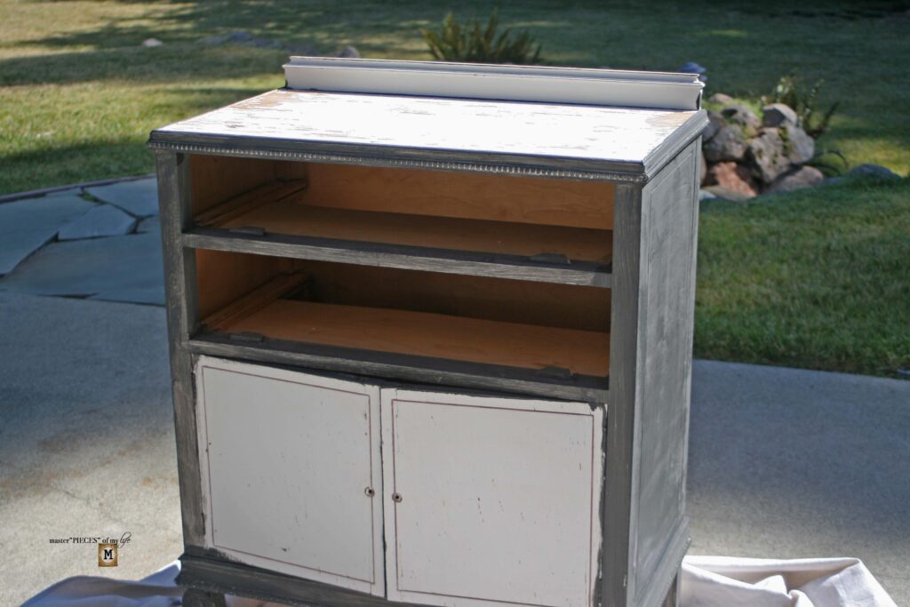 an old, shabby dresser refurbished into an outdoor sideboard