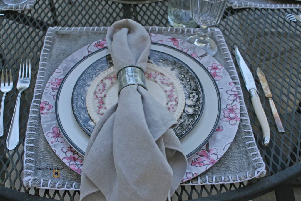 pink floral tablescape with DIIY oilcloth charger