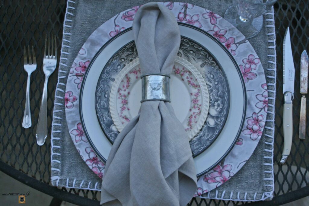 pink floral tablescape with DIIY oilcloth charger