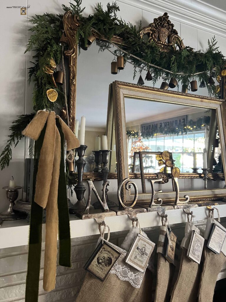 Christmas mantel with bells and velvet ribbons