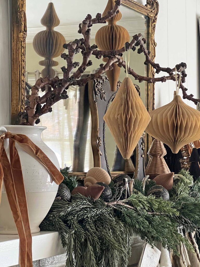 Christmas mantel decorated in neutral browns