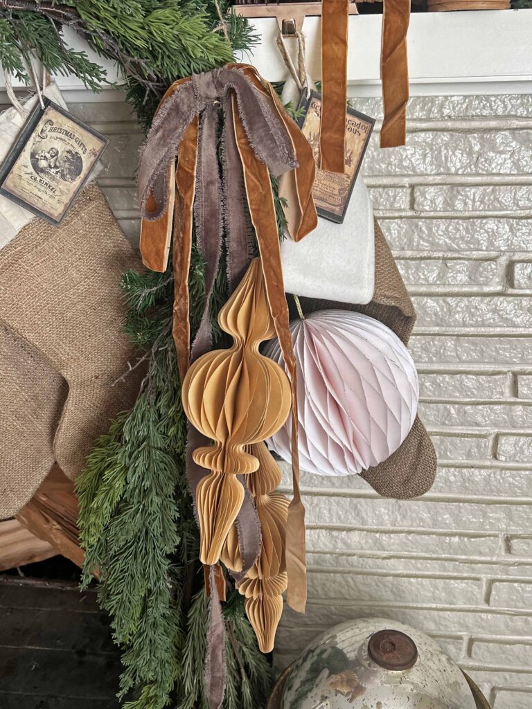 Christmas mantel decorated in neutral browns