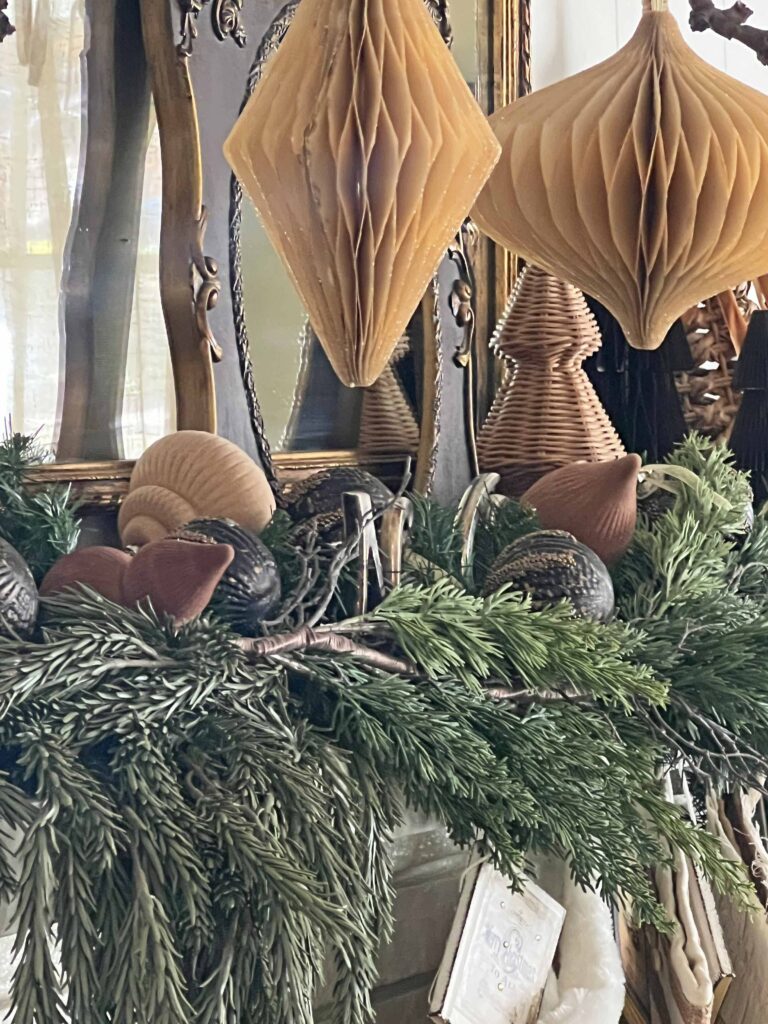 Christmas mantel decorated in neutral browns