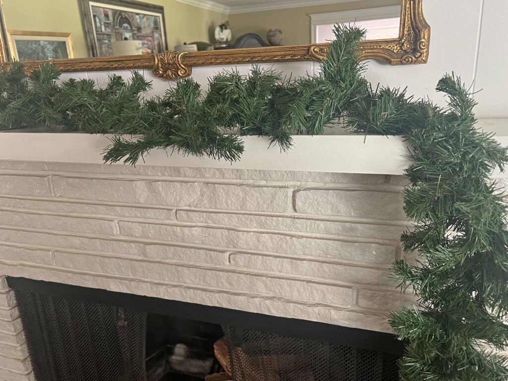Christmas mantel decorated in neutral browns
