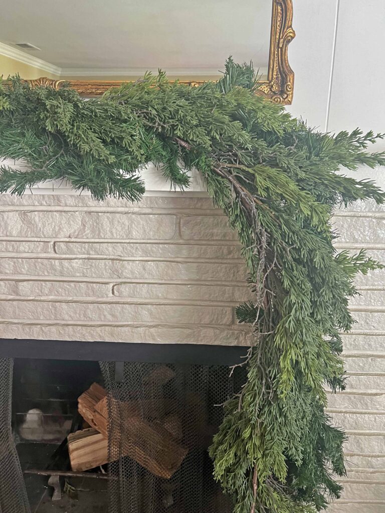 Christmas mantel decorated in neutral browns