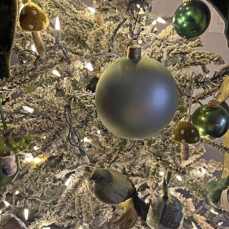 A Petite Christmas Tree Decked in Green Decor