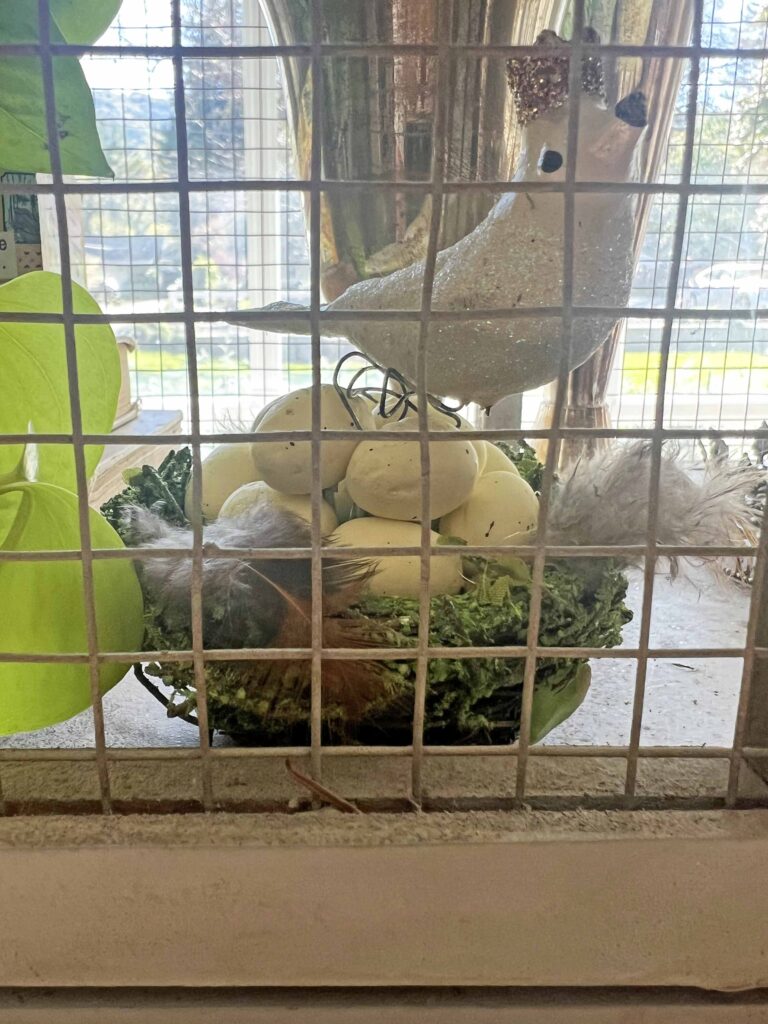 how to style a simple Easter Vignette in an ornamental birdcage