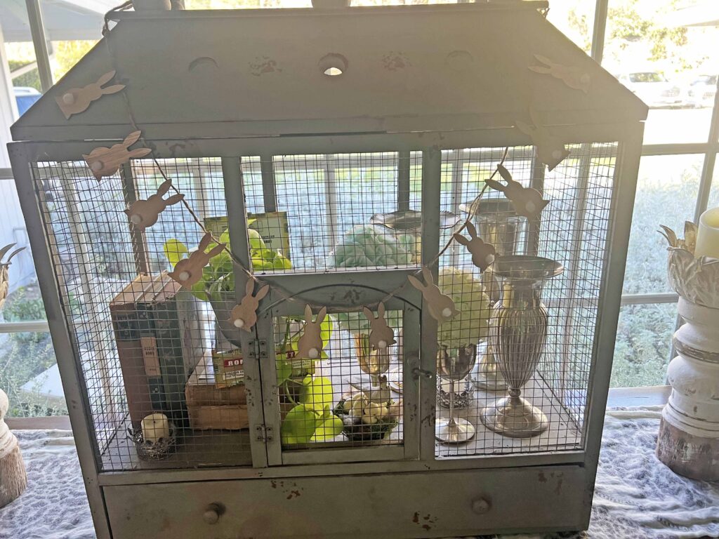 how to style a simple Easter Vignette in an ornamental birdcage