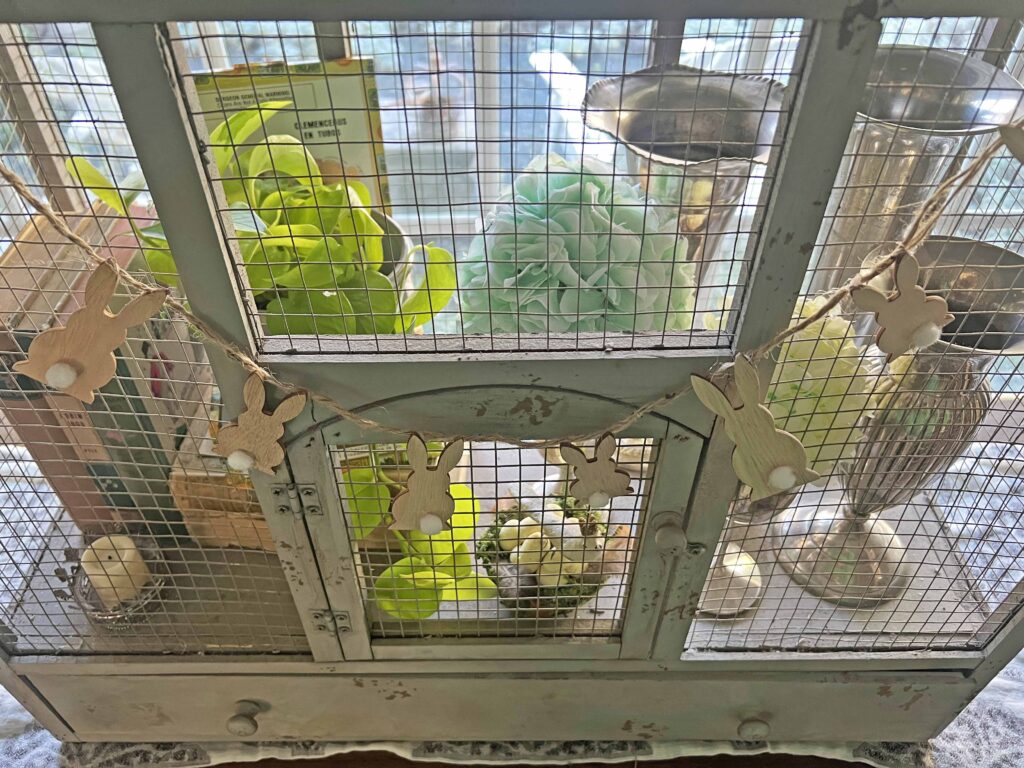 how to style a simple Easter Vignette in an ornamental birdcage