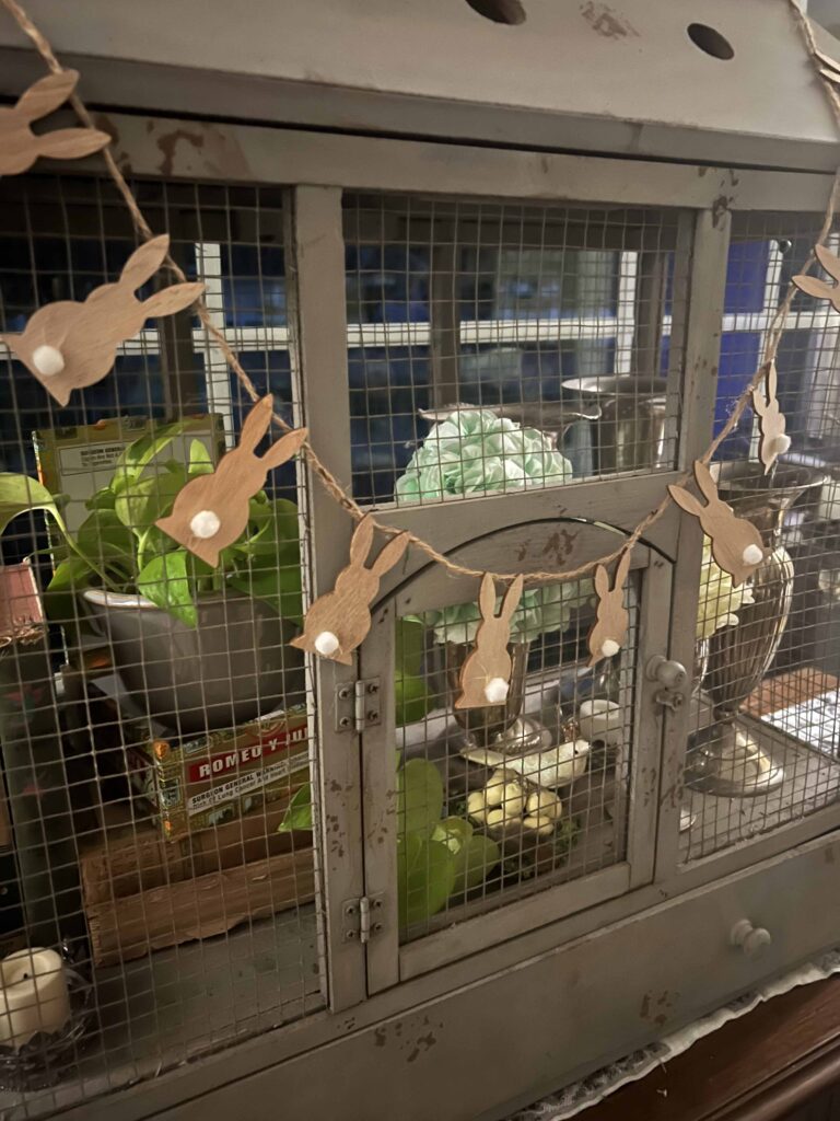 how to style a simple Easter Vignette in an ornamental birdcage