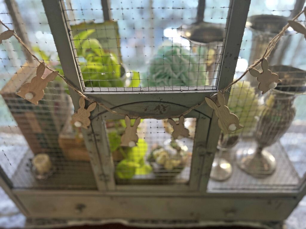 how to style a simple Easter Vignette in an ornamental birdcage