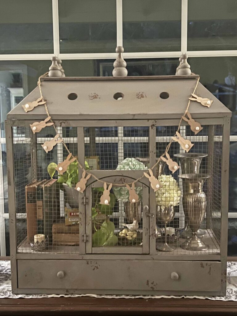how to style a simple Easter Vignette in an ornamental birdcage