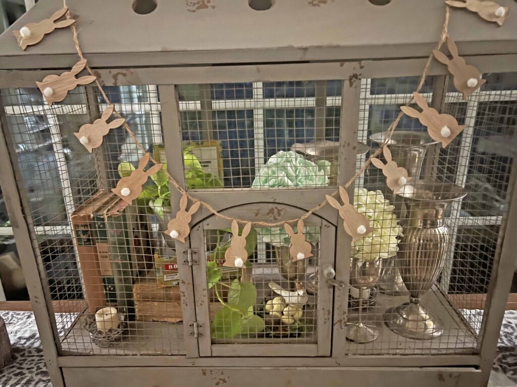 how to style a simple Easter Vignette in an ornamental birdcage