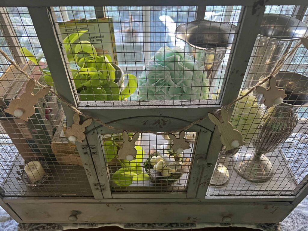 how to style a simple Easter Vignette in an ornamental birdcage