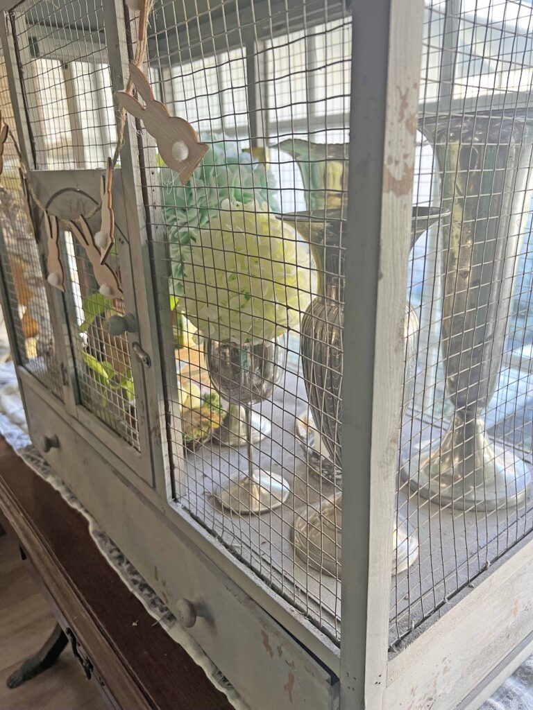 how to style a simple Easter Vignette in an ornamental birdcage