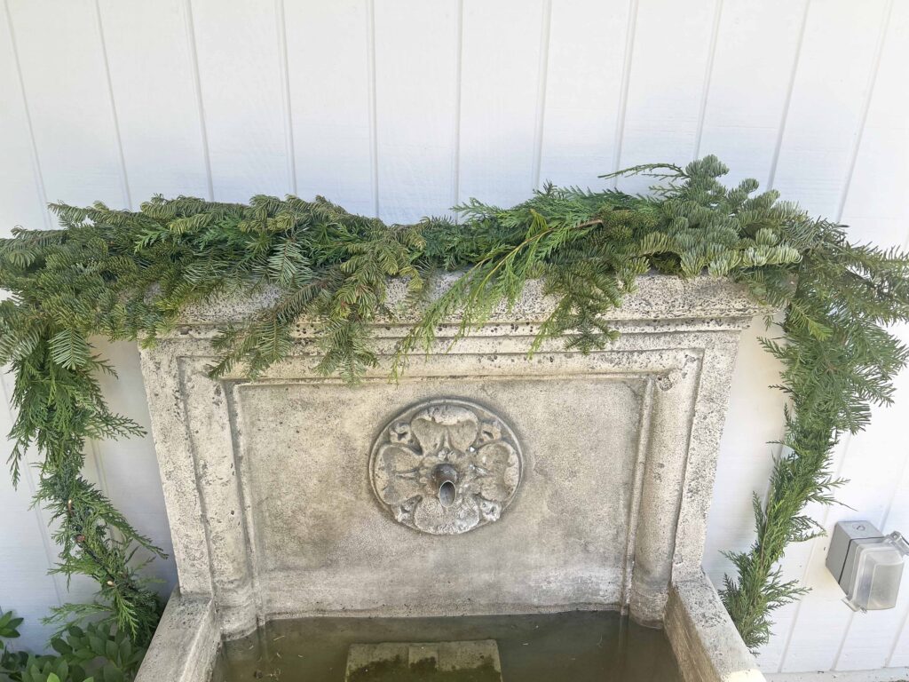 how to decorate an outdoor fountain for Christmas