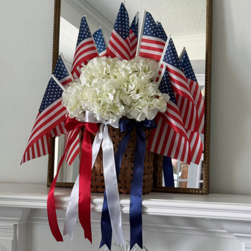 4th of July red, white and blue arrangement with flags and ribbons