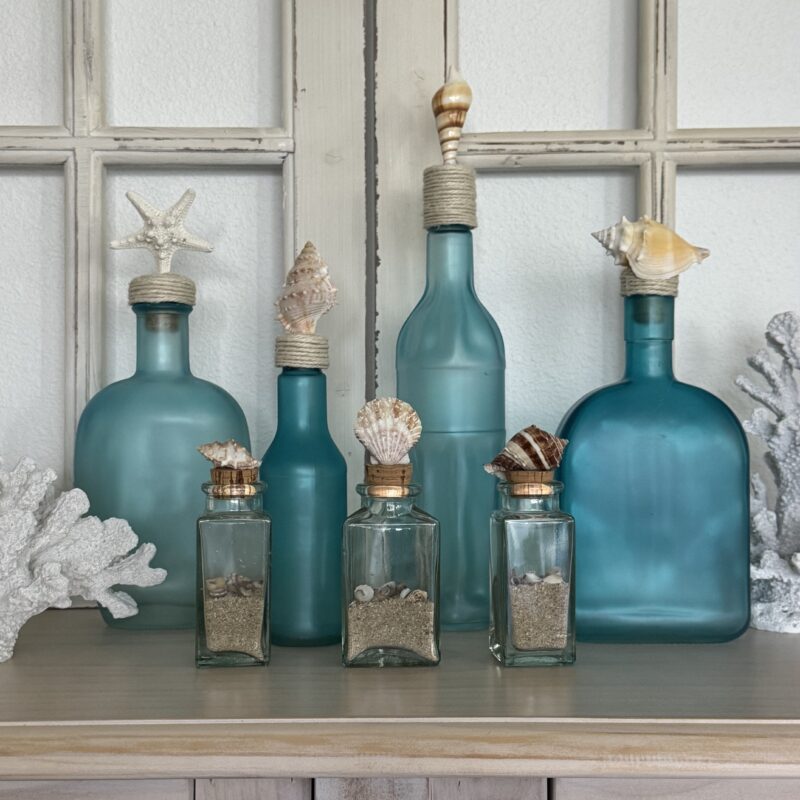 sea glass bottles with sea shell tops