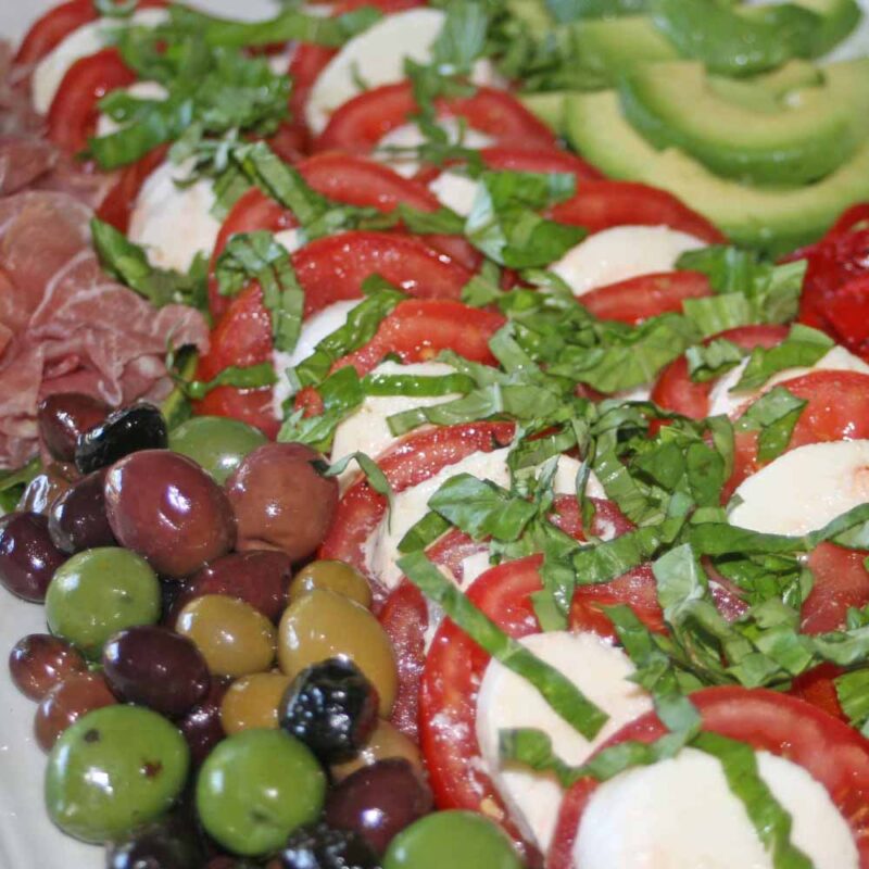 summer salad with tomatoes, olives, mozzarella and basil