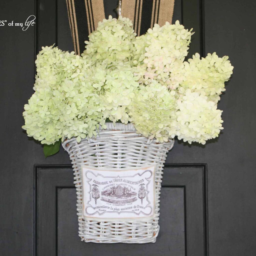 Weathered thrift basket hanging front door with hydrangeas