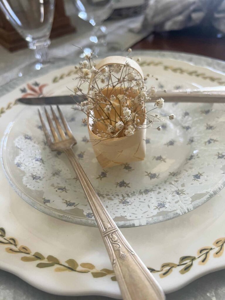 How to Create a Unique Floral Table Setting with Thrifted Baskets Place settings Floral basket favor with baby's breath