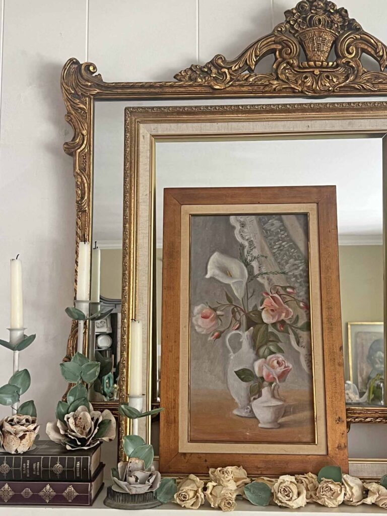 Summer fireplace mantel styling: A vintage rose inspired display for a collected home -rose tole candle sticks and heirloom painting