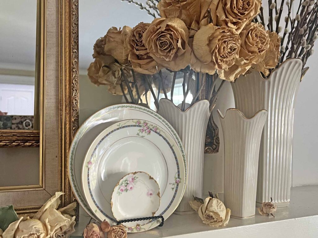 Summer fireplace mantel styling: A vintage rose inspired display for a collected home - dried roses and thrifted vintage plates
