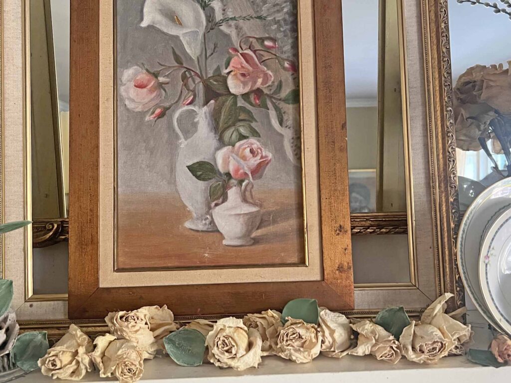 Summer fireplace mantel styling: A vintage rose inspired display for a collected home - scattered roses
