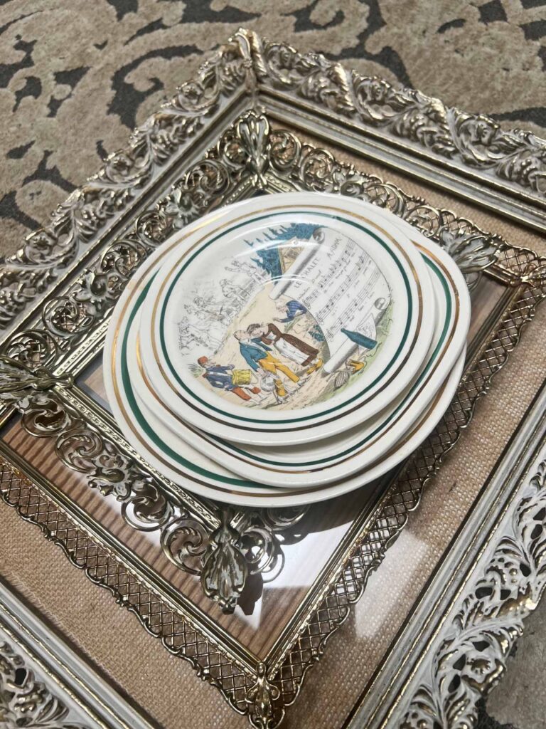 how to curate a gallery wall with thrifted collections French Opera Plates and metal gold filigree frames